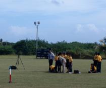 Members of the rocketry club check their connections while the rcket sits, waiting to launch. Members of the rocketry club check their connections while the rcket sits, waiting to launch.